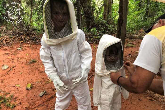 Kids in beekeeper suits
