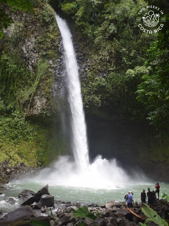 View of waterfall splashing into natural pool