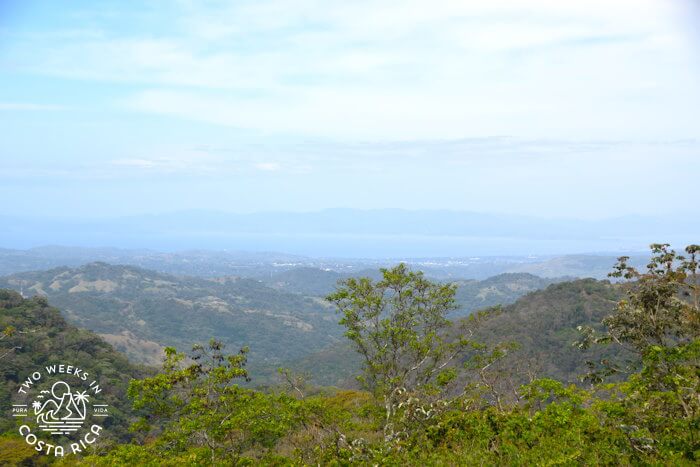 View from mountaintop with water in distance