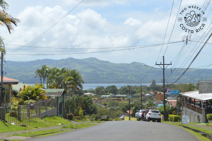 road and homes with view of lake and mountains in distance