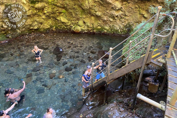 staircase leading down into a natural pool
